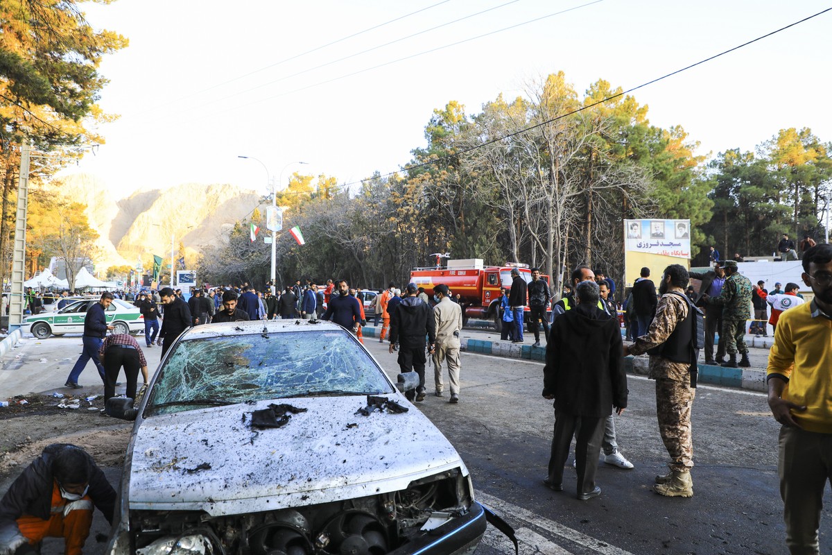 epa11055690 Damaged vehicles after explosions at a commemoration ceremony next to the tomb of Iran's Revolutionary Guards chief of foreign operations Iranian General Qasem Soleimani in the Saheb  ...
