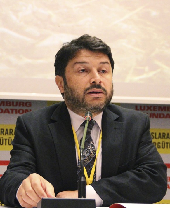 In this May 2016 photo provided by Amnesty International, Turkey on Friday Oct. 27, 2017, Taner Kilic, Amnesty International&#039;s Turkey chairman, talks during a speech at a conference on refugees i ...