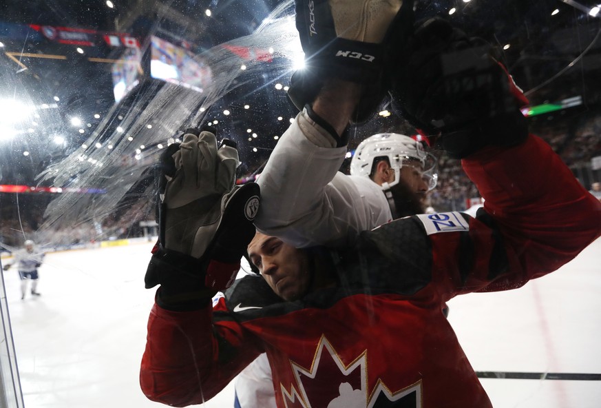 France&#039;s Antonin Manavian, right, challenges Canada&#039;s Travis Konecny, left, during the Ice Hockey World Championships group B match between Canada and France in the AccorHotels Arena in Pari ...