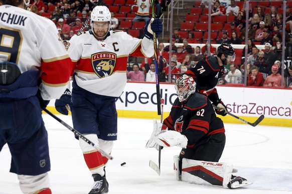 Florida Panthers&#039; Aleksander Barkov, right, celebrates his goal with Florida Panthers&#039; Matthew Tkachuk (19) as Carolina Hurricanes goaltender Pyotr Kochetkov (52) looks on during the third p ...