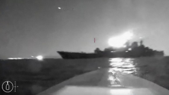 In this grab taken from video released on Friday, Aug. 4, 2023, a drone manoeuvers as it approaches the vessel claimed to be a Russian large landing ship, the Olenegorsky Gonyak, close to the Black Se ...