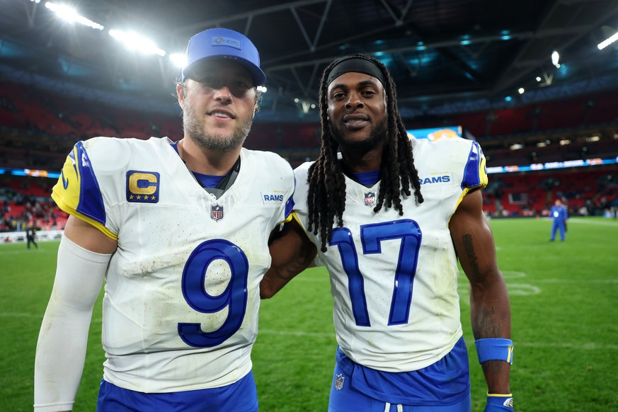 Los Angeles Rams quarterback Matthew Stafford (9) and wide receiver Davante Adams (17) stand on the field after an NFL football game between the Los Angeles Rams and the Jacksonville Jaguars in London ...