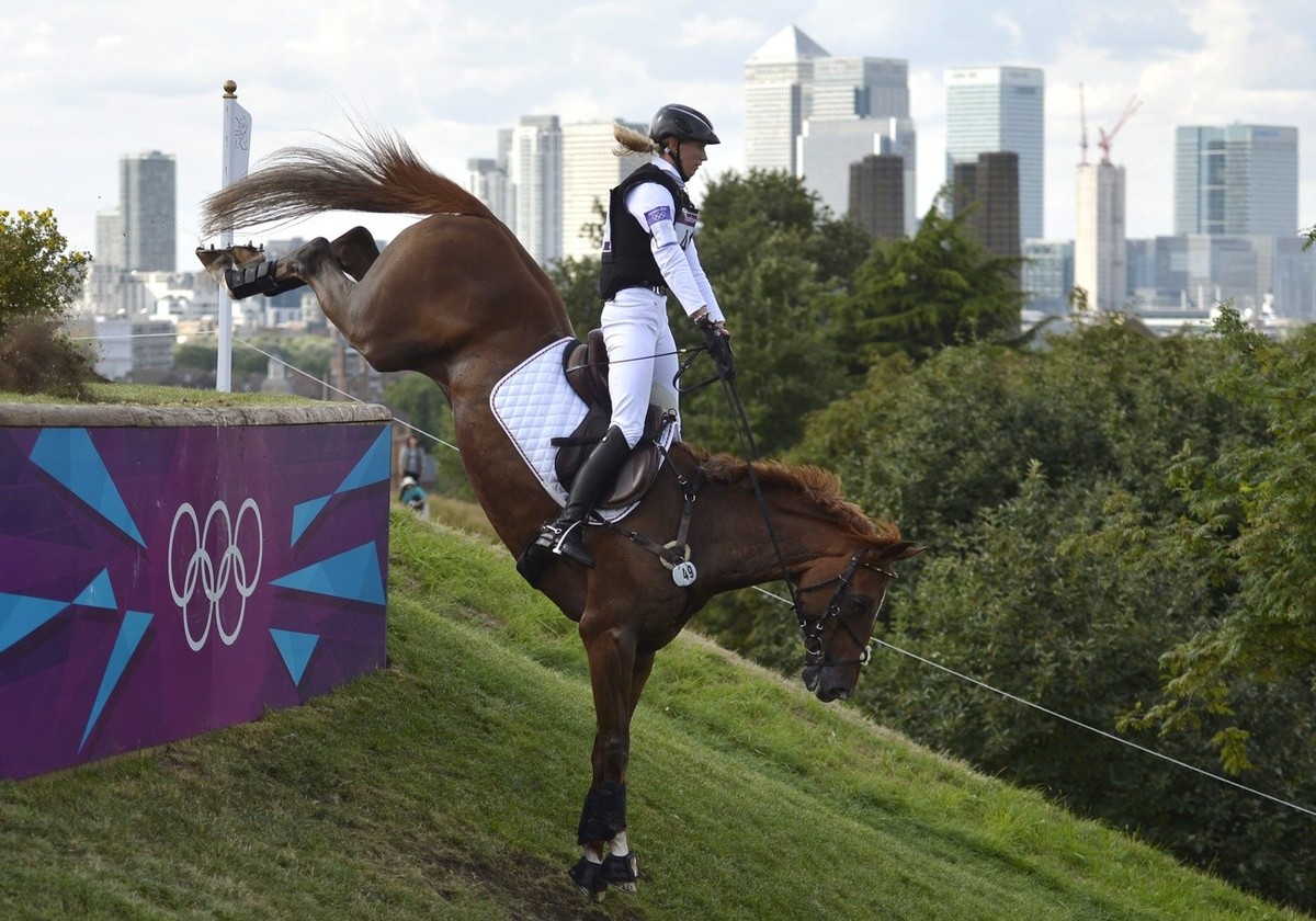 epa03327686 Sandra Auffarth of Germany rides her horse 'Opgun Louvo' at the Cross Country event of the Equestrian Eventing for the London 2012 Olympic Games in Greenwich Park, south of Londo ...
