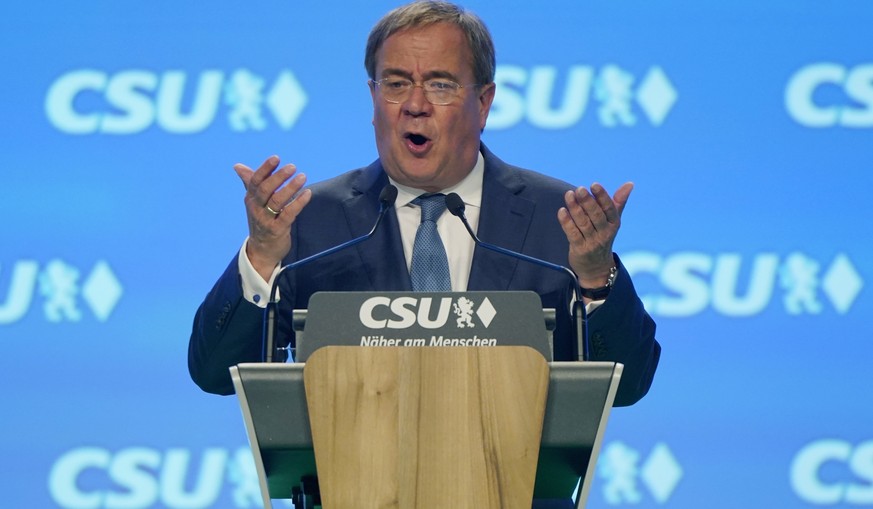 epa09460777 Christian Democratic Union (CDU) party chairman and top candidate for the upcoming federal elections Armin Laschet delivers a speech during a Congress of the Christian Social Union (CSU) p ...