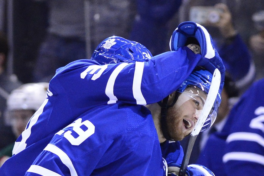 Toronto Maple Leafs right wing William Nylander, right, is hugged by teammate Auston Matthews (34) after scoring against the Minnesota Wild during the second period of an NHL hockey game, Thursday, Ja ...