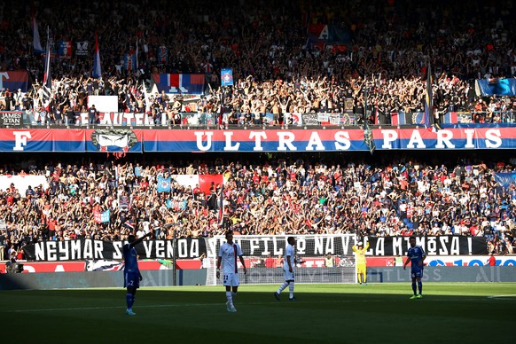 epa07842434 fans hold a banner writes on portuguese against Paris Saint-Germain&#039;s Neymar Jr during the French soccer Ligue 1 match between Paris Saint Germain (PSG) and Strasbourg at the Parc des ...