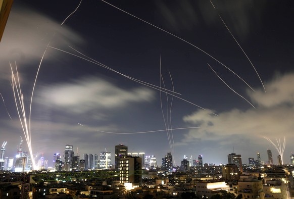 epa12182449 The Iron Dome, the Israeli air defense system, intercepts missiles fired from Iran, over Tel Aviv, Israel, 17 June 2025. Israel and Iran have been exchanging fire since Israel attacked Ira ...