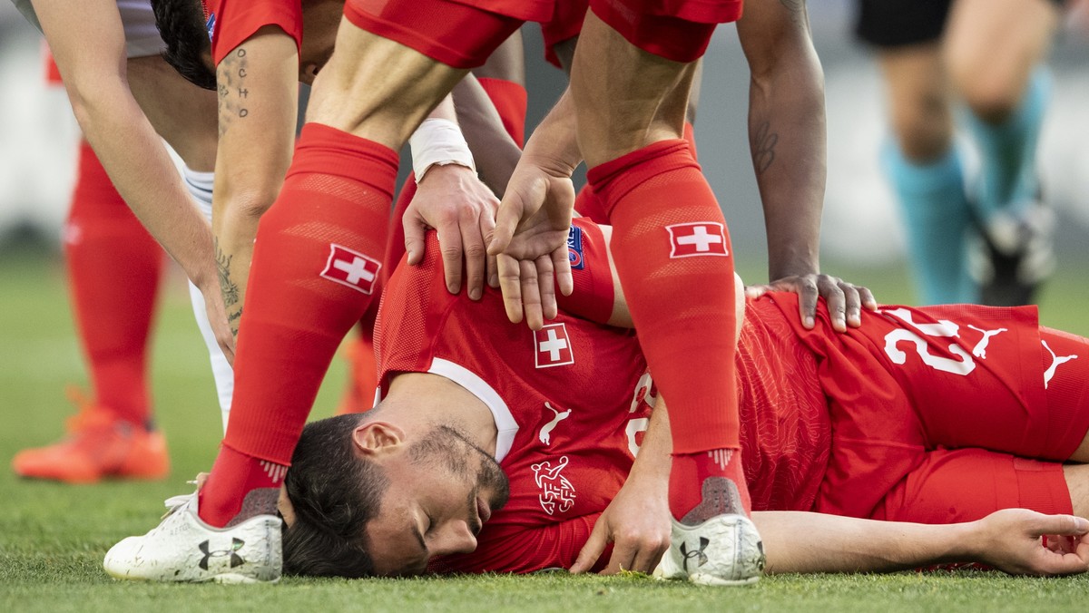 epa07458445 Switzerland's Fabian Schaer (C) lies down on the ground during the UEFA Euro 2020 qualifier Group D soccer match between Georgia and Switzerland at the Boris Paichadze National Stadiu ...