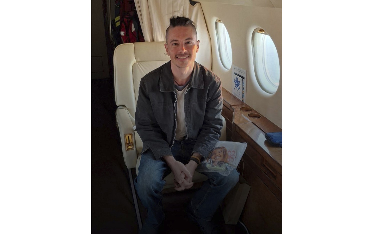 This photo provided by the The Crisis and Support Centre of the Ministry for Europe and Foreign Affairs on Thursday, March 20, 2025 shows France&#039;s Olivier Grondeau sitting in a plane after being  ...