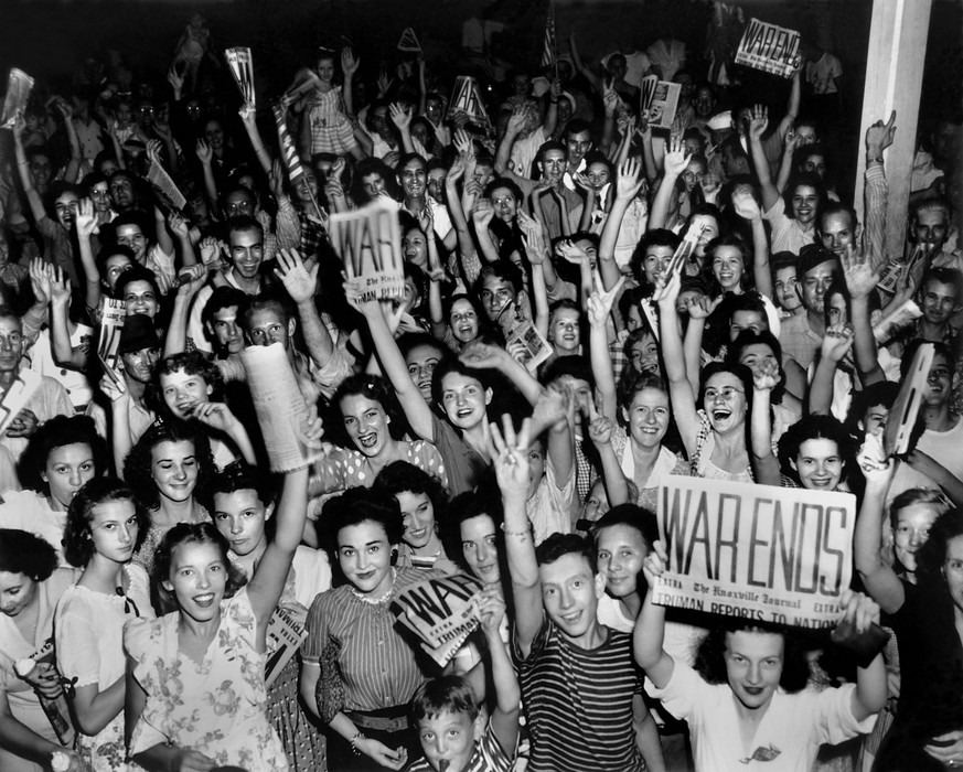 Victory over Japan Day (V-J Day) celebration in Jackson Square in downtown Oak Ridge, home of part of the Manhattan Project, 14th August 1945. When the first atomic bomb was dropped on Japan on August ...