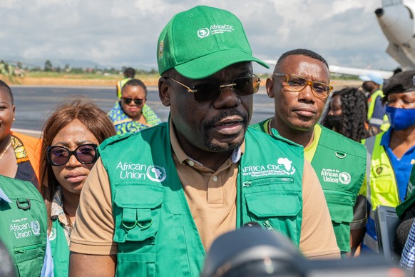 epa12982208 Director General of Africa Centres for Disease Control and Prevention (Africa CDC), Jean Kaseya (C) arrives at Bunia Airport to lead the response to the Ebola outbreak caused by the Bundib ...