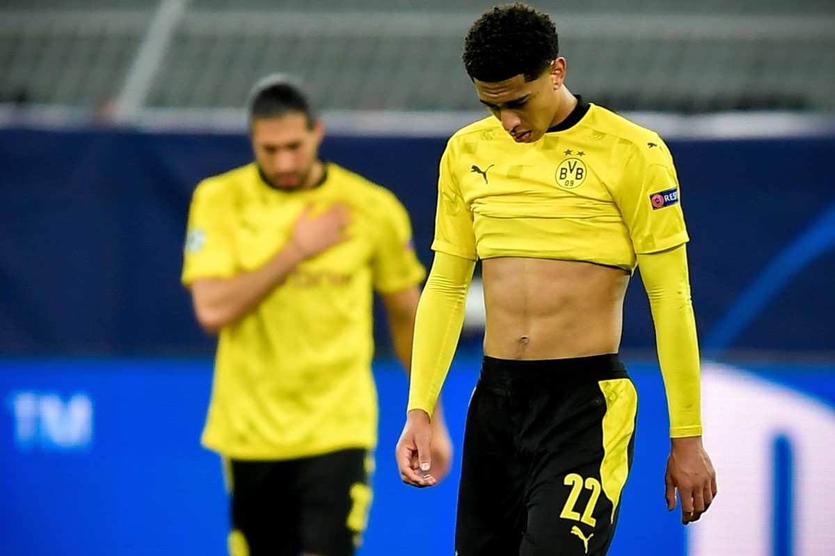epa09135904 Dortmund's Jude Bellingham (R) reacts after conceding the 1-2 goal during the UEFA Champions League quarter final, second leg soccer match between Borussia Dortmund and Manchester Cit ...