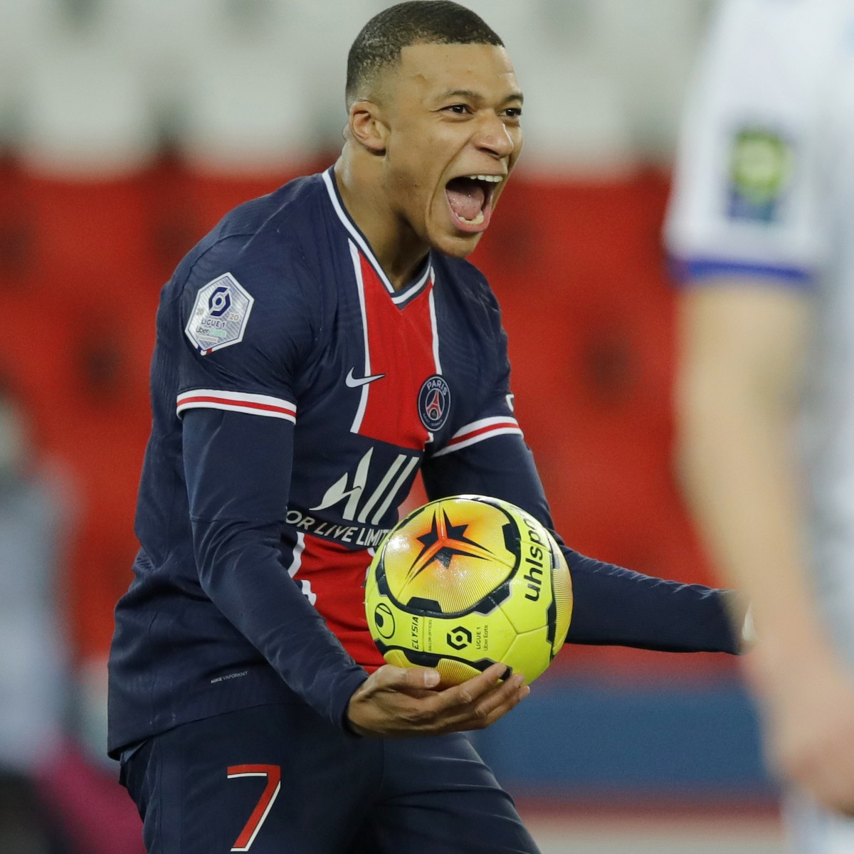PSG's Kylian Mbappe celebrates after scoring his side's second goal during the French League One soccer match between Paris Saint-Germain and Strasbourg at the Parc des Princes in Paris, Fra ...