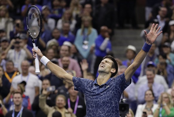 Novak Djokovic, of Serbia, celebrates after defeating Juan Martin del Potro, of Argentina, in the men&#039;s final of the U.S. Open tennis tournament, Sunday, Sept. 9, 2018, in New York. (AP Photo/Jul ...