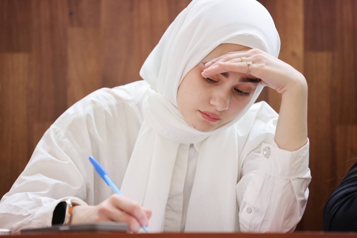 RUSSIA, GROZNY - APRIL 20, 2024: A woman takes part in the 2024 Total Dictation, an annual Russian language test, at Chechen State Pedagogical University. Yelena Afonina/TASS PUBLICATIONxINxGERxAUTxON ...
