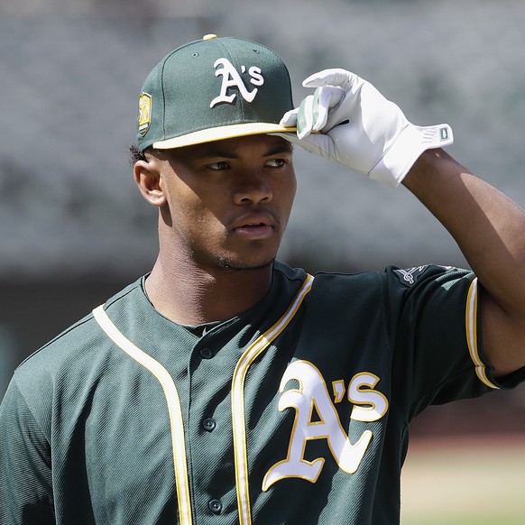 FILE - In this June 15, 2018, file photo, Oakland Athletics draft pick Kyler Murray looks on before a baseball game between the Athletics and the Los Angeles Angels, in Oakland, Calif. The A&#039;s st ...