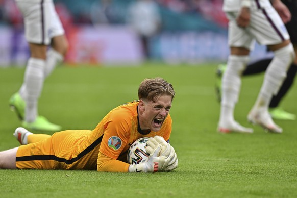 England&#039;s goalkeeper Jordan Pickford reacts after saving a shot during the Euro 2020 soccer championship round of 16 match between England and Germany at Wembley Stadium in England, Tuesday June  ...