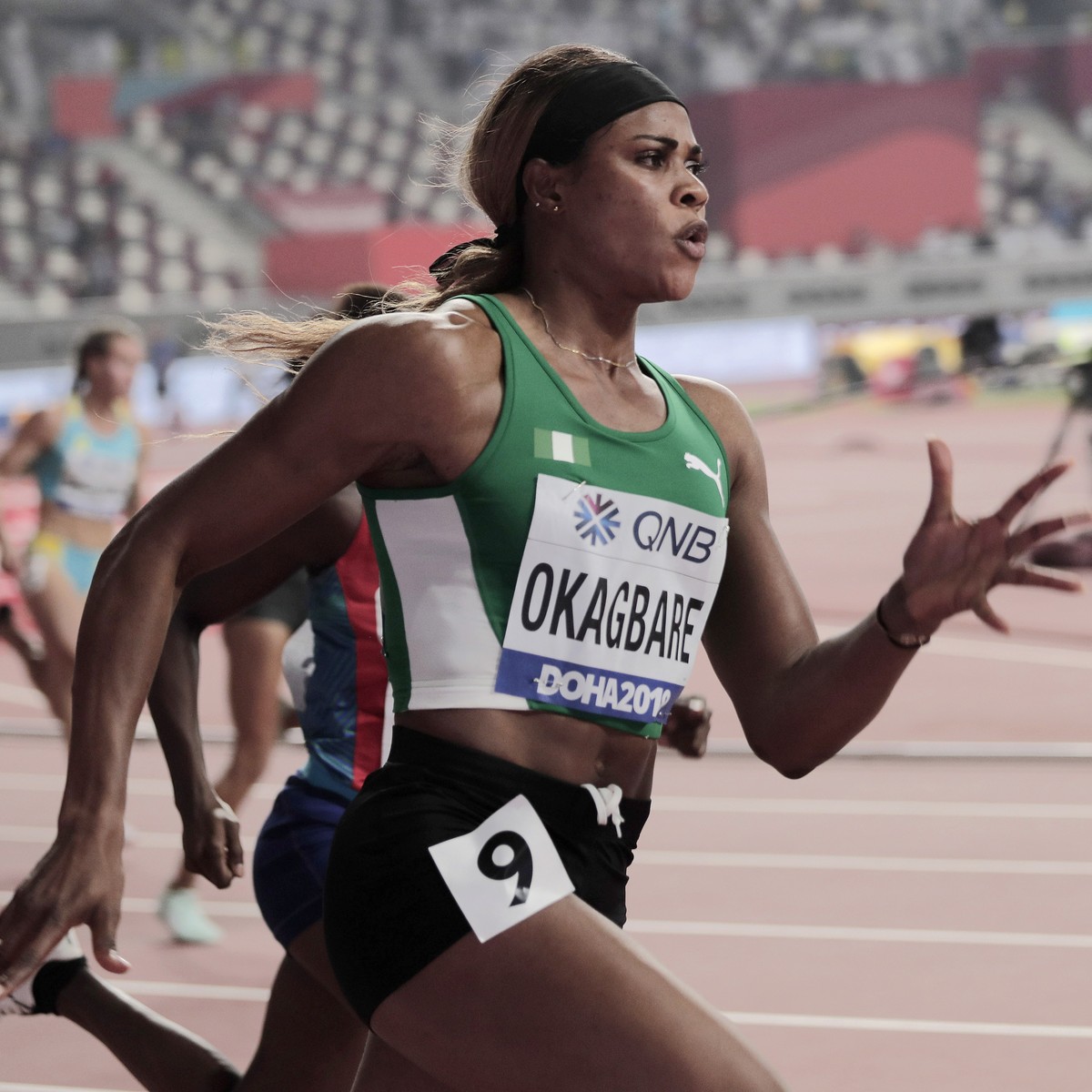 Blessing Okagbare, of Nigeria races in a women's 200 meter heat at the World Athletics Championships in Doha, Qatar, Sept. 30, 2019. U.S. prosecutors charged a Texas man on Wednesday, Jan. 12, 20 ...