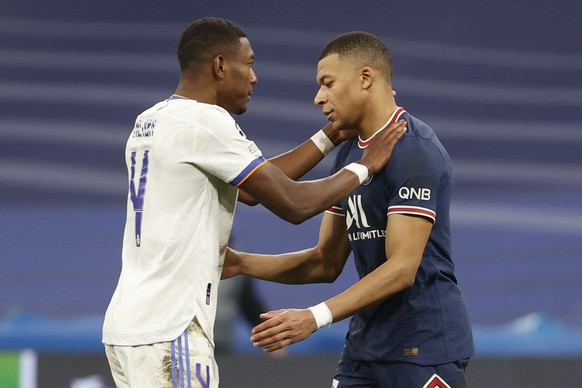 epa09813714 Real Madrid&#039;s David Alaba (L) and Paris Saint-Germain&#039;s Kylian Mbappe (R) react after the UEFA Champions League round of 16, second leg soccer match between Real Madrid and Paris ...