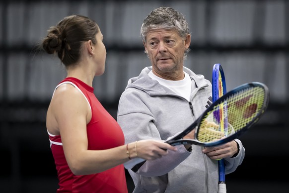 Belinda Bencic of Switzerland, left, speaks with her coach Iain Hughes during a training day of Billie Jean King Cup (BJK Cup), at the Swiss Tennis Arena in Biel, Switzerland, Tuesday, November 12, 20 ...