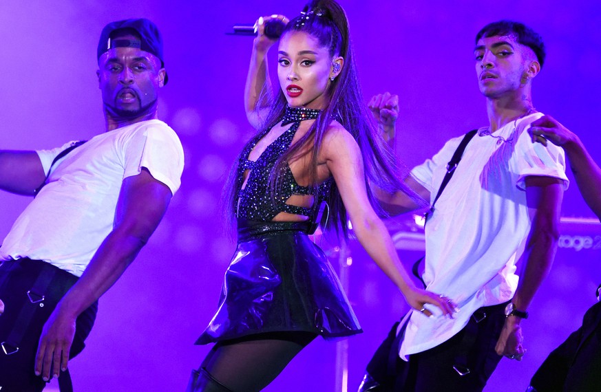 FILE - In this June 2, 2018 file photo, Ariana Grande, center, performs at Wango Tango in Los Angeles. Grande is 27 on June 26. (Photo by Chris Pizzello/Invision/AP, File)
Ariana Grande