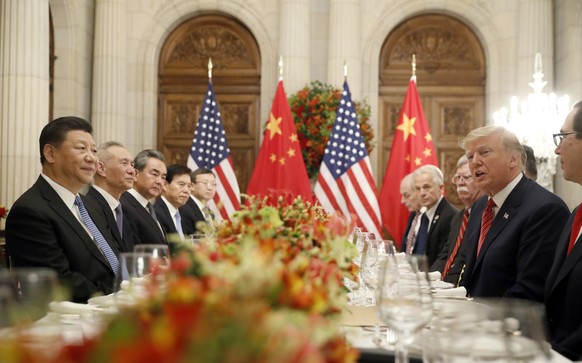 FILE - In this Dec. 1, 2018, file photo President Donald Trump speaks as China&#039;s President Xi Jinping listens during their bilateral meeting at the G20 Summit in Buenos Aires, Argentina. Trump me ...