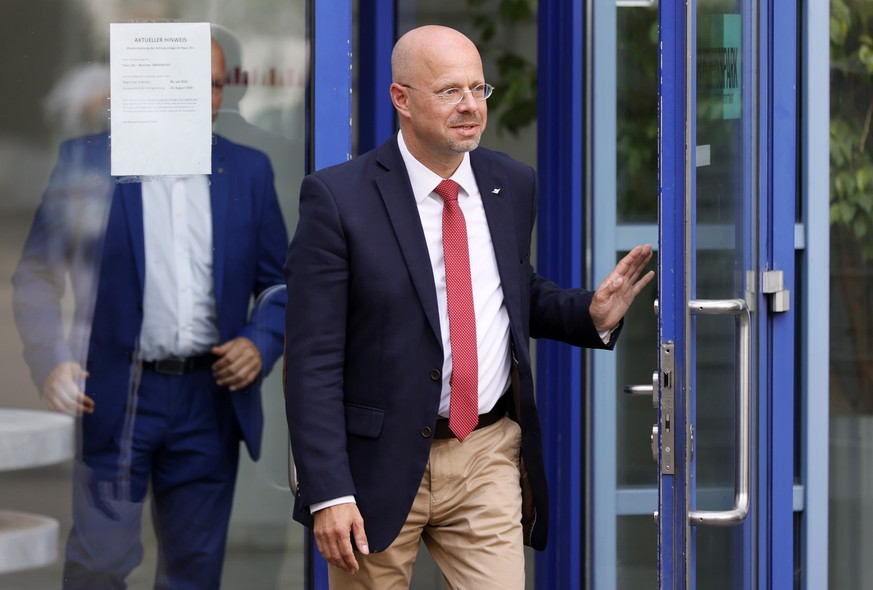 epa08565675 Andreas Kalbitz of the Alternative for Germany (AfD) right-wing populist party leaves after a hearing at the Federal Arbitration Court of the Alternative for Germany (AfD) in Stuttgart, Ge ...