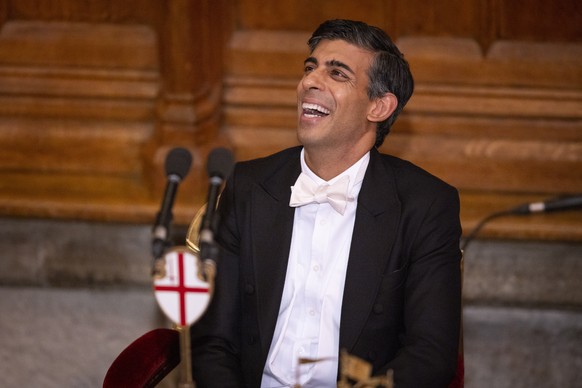 epa10335523 British Prime Minister Rishi Sunak listens to speeches at the Lord Mayor&#039;s Banquet in London, Britain, 28 November 2022. The Lord Mayor&#039;s Banquet is an annual ceremony that marks ...
