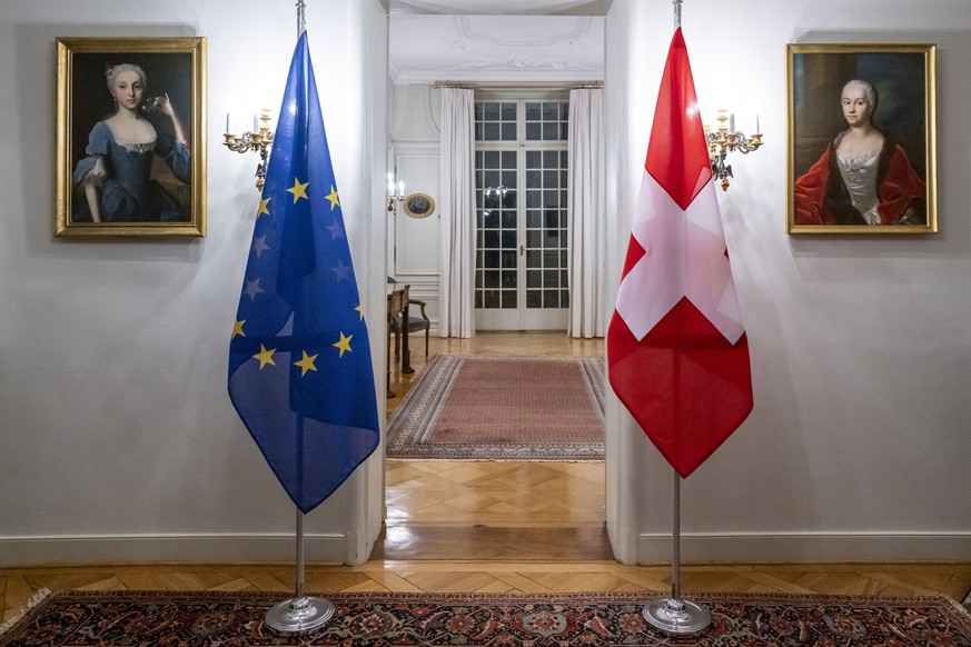 A Swiss flag, right, and an European flag stand in a room before the working visit from Maros Sefcovic, Vice-President of the European Commission by Swiss Federal Councilor Ignazio Cassis, in Bern, Sw ...