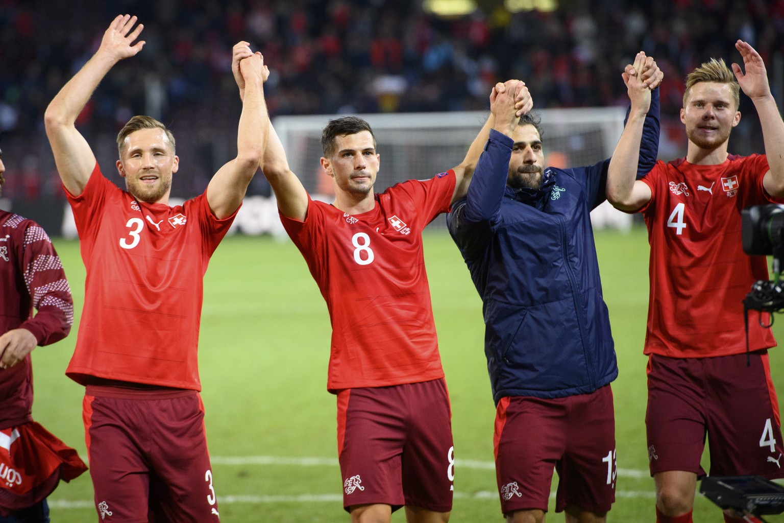 epa09515807 From left, Switzerland&#039;s Silvan Widmer, Remo Freuler, Ricardo Rodriguez and Nico Elvedi celebrate after the 2022 FIFA World Cup European Qualifying Group C football match between Swit ...