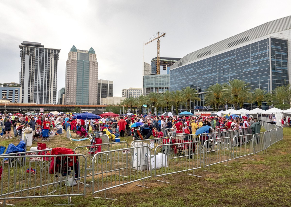epa07656654 US President Donald J. Trump's supporters make a line to enter the Amway center to attend Trump's 2020 re-election bid announcement in Orlando, Florida, USA, 18 June 2019. Presid ...