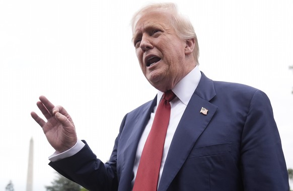 KEYPIX - President Donald Trump talks to reporters on the South Lawn of the White House before he boards Marine One en route to Joint Base Andrews, Md., Friday, Aug. 1, 2025, in Washington. (AP Photo/ ...