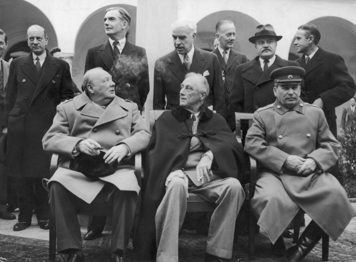 8th February 1945: Winston Churchill, Franklin Delano Roosevelt and Joseph Stalin, seated from left to right, in the grounds of the Livadia Palace, Yalta, the US headquarters in Russia, where they met ...
