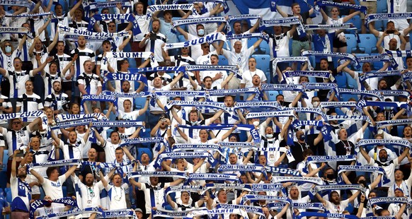 epa09302881 (FILE) - Supporters of Finland cheer prior to the UEFA EURO 2020 group B preliminary round soccer match between Finland and Belgium in St.Petersburg, Russia, 21 June 2021 (re-issued on 26  ...