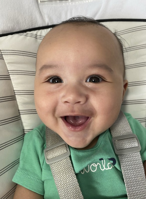 In this undated photo provided by Gerber, 4-month-old Zane Kahin, of Winter Park, Fla., smiles for the camera. Zane has been chosen as the new