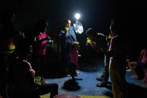A man gives a girl a spoonful of soup on a street during a blackout in Havana, Wednesday, March 4, 2026. (AP Photo/Ramon Espinosa)
Cuba Blackout