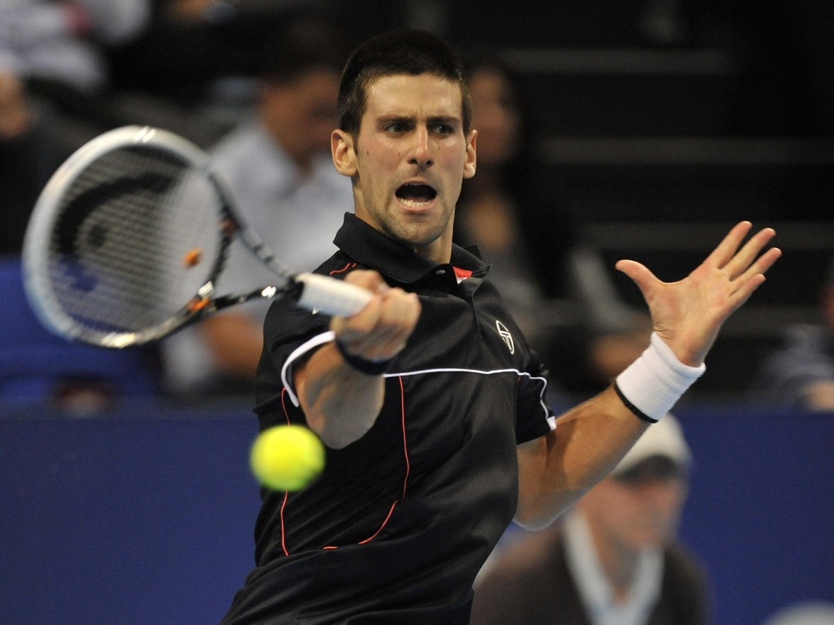 Serbia's Novak Djokovic returns a ball to Japan's Kei Nishikori during their semifinal match at the Swiss Indoors tennis tournament at the St. Jakobshalle in Basel, Switzerland, Saturday, No ...