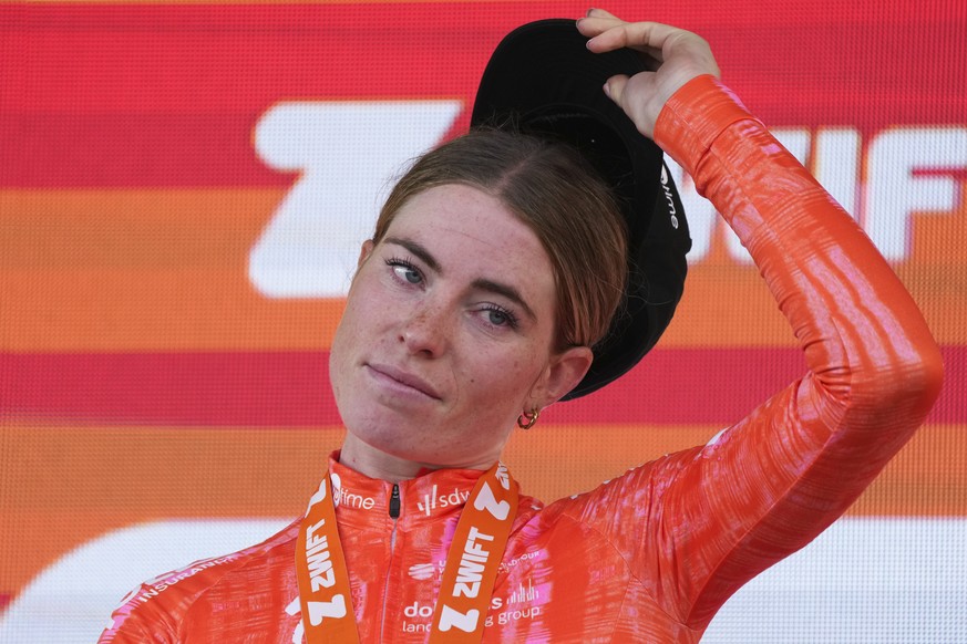 Stage winner Demi Vollering of The Netherlands reacts on the podium after the eighth stage of the Tour de France Women cycling race with start in Le Grand-Bornand and finish in Alpe d&#039;Huez, Franc ...