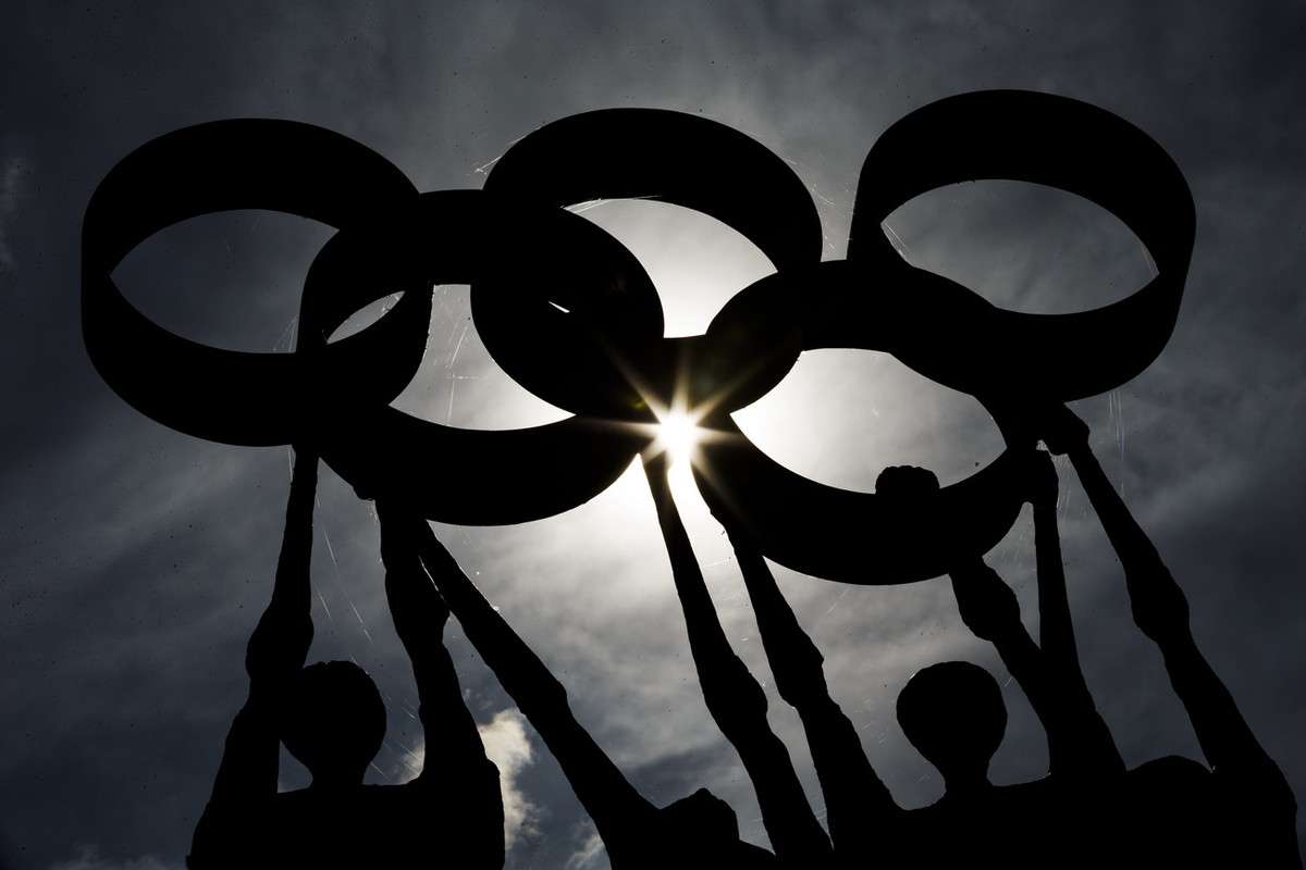 A statue representing people carrying the Olympic rings is pictured in front of the International Olympic Committee headquarters in Lausanne, Switzerland, on Tuesday, June 17, 2014. (KEYSTONE/Valentin ...