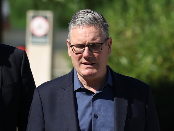 Britain's Prime Minister Keir Starmer walks, as he visits a housing development in north London, Friday, June 19, 2026. (Peter Macdiarmid/Pool Photo via AP)
Keir Starmer