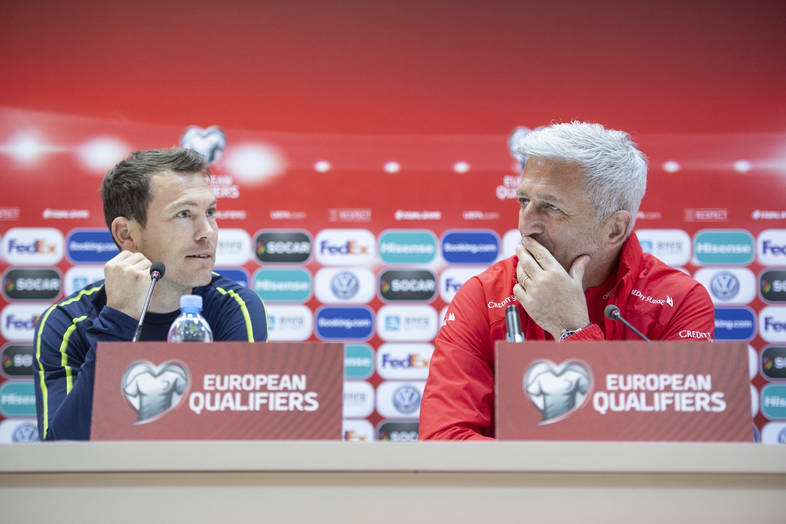 Switzerland&#039;s head coach Vladimir Petkovic, right, speaks next to Stephan Lichtsteiner, left, during the press conference at the Boris Paitchadze Dinamo Arena in Tbilisi, Georgia, Friday, 22 Marc ...