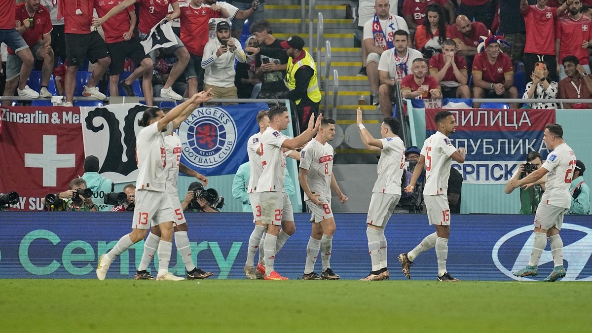 Switzerland's Remo Freuler, center, celebrates with teammates after scoring his side's third goal during the World Cup group G soccer match between Serbia and Switzerland, at the Stadium 974 ...