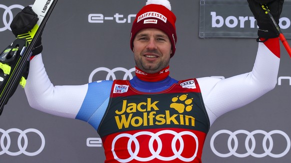 Switzerland's Beat Feuz celebrates his second place in an alpine ski, men's World Cup downhill, in Bormio, Italy, Friday, Dec. 27, 2019. (AP Photo/Alessandro Trovati)