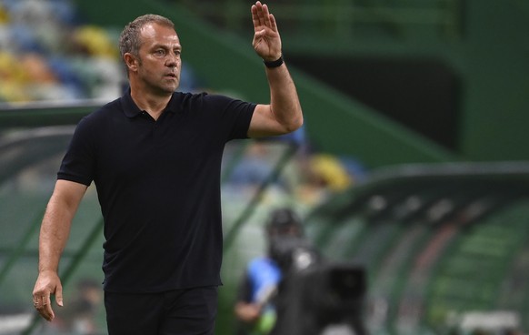 Bayern&#039;s interim head coach Hans-Dieter Flick gives instructions to his players during the Champions League semifinal soccer match between Lyon and Bayern at the Jose Alvalade stadium in Lisbon,  ...