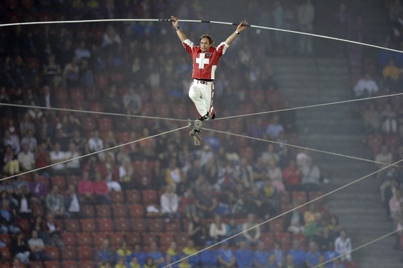 Swiss high wire artist Freddy Nock performs during the opening ceremony at the end of the first day of competition at the European Athletics Championships in the Letzigrund Stadium in Zurich, Switzerl ...