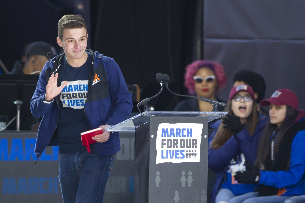 Cameron Kasky, a survivor of the mass shooting at Marjory Stoneman Douglas High School in Parkland, Fla., waves after speaking at the "March for Our Lives" rally in support of gun control in ...