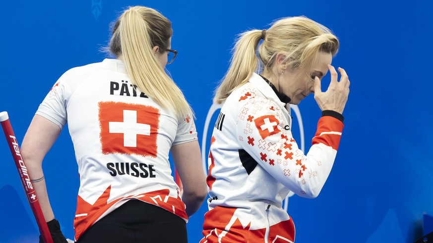 Switzerland skip Silvana Tirinzoni, center, and her teammates Alina Paetz, left, and Esther Neuenschwander, right, look disappointed after losing against Japan team during the Curling semifinal game o ...