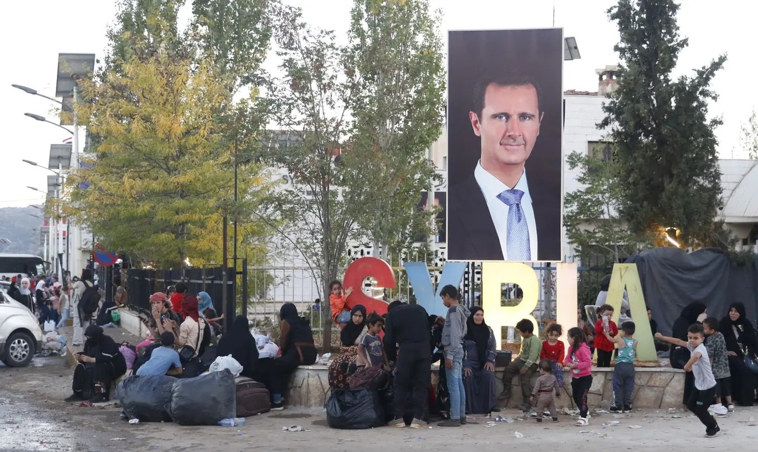 Syrische und libanesische Familien, die vor den Kämpfen im Libanon nach Syrien geflohen sind.