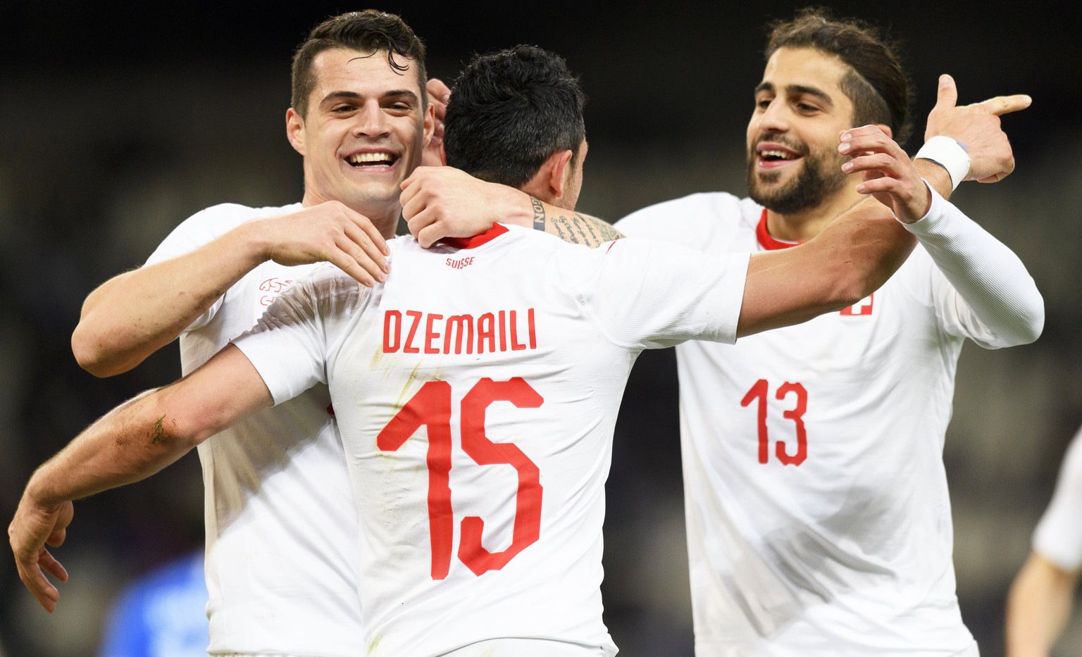 epa06624697 Switzerland&#039;s midfielder Blerim Dzemaili (C) celebrates with his teammates Granit Xhaka (L) and Ricardo Rodriguez (R) after scoring the 1-0 lead during the International Friendly socc ...