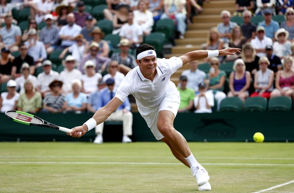 epa06079644 Milos Raonic of Canada in action against Alexander Zverev of Germany during their fourth round match for the Wimbledon Championships at the All England Lawn Tennis Club, in London, Britain ...